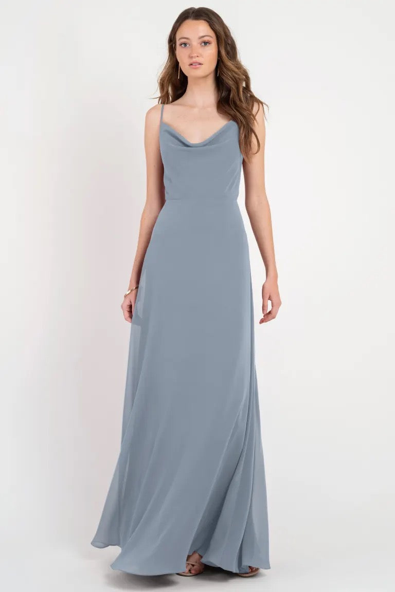 Woman posing in a long gray Colby - Jenny Yoo Bridesmaid Dress with a twirl-worthy skirt from Bergamot Bridal.