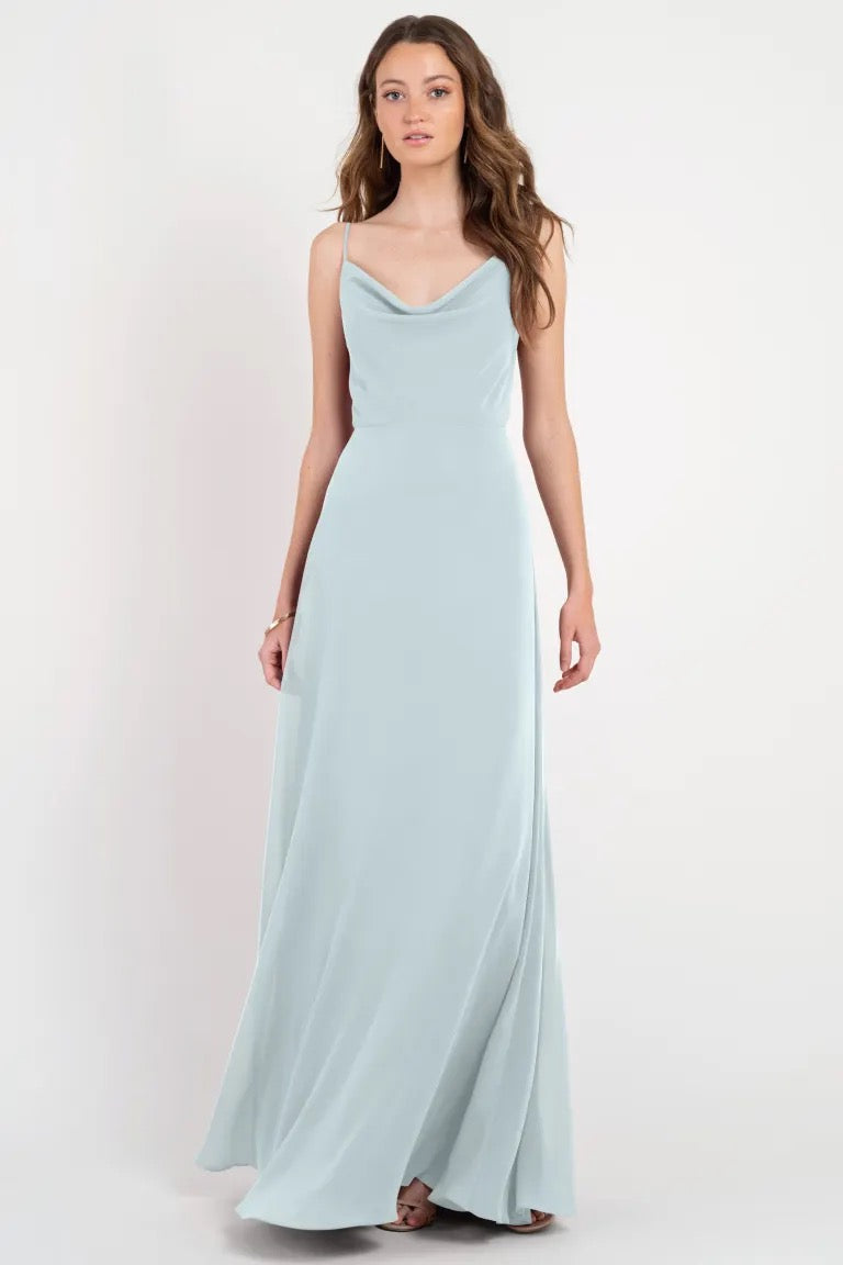 Woman posing in a light blue Colby - Jenny Yoo Bridesmaid Dress evening gown by Bergamot Bridal.