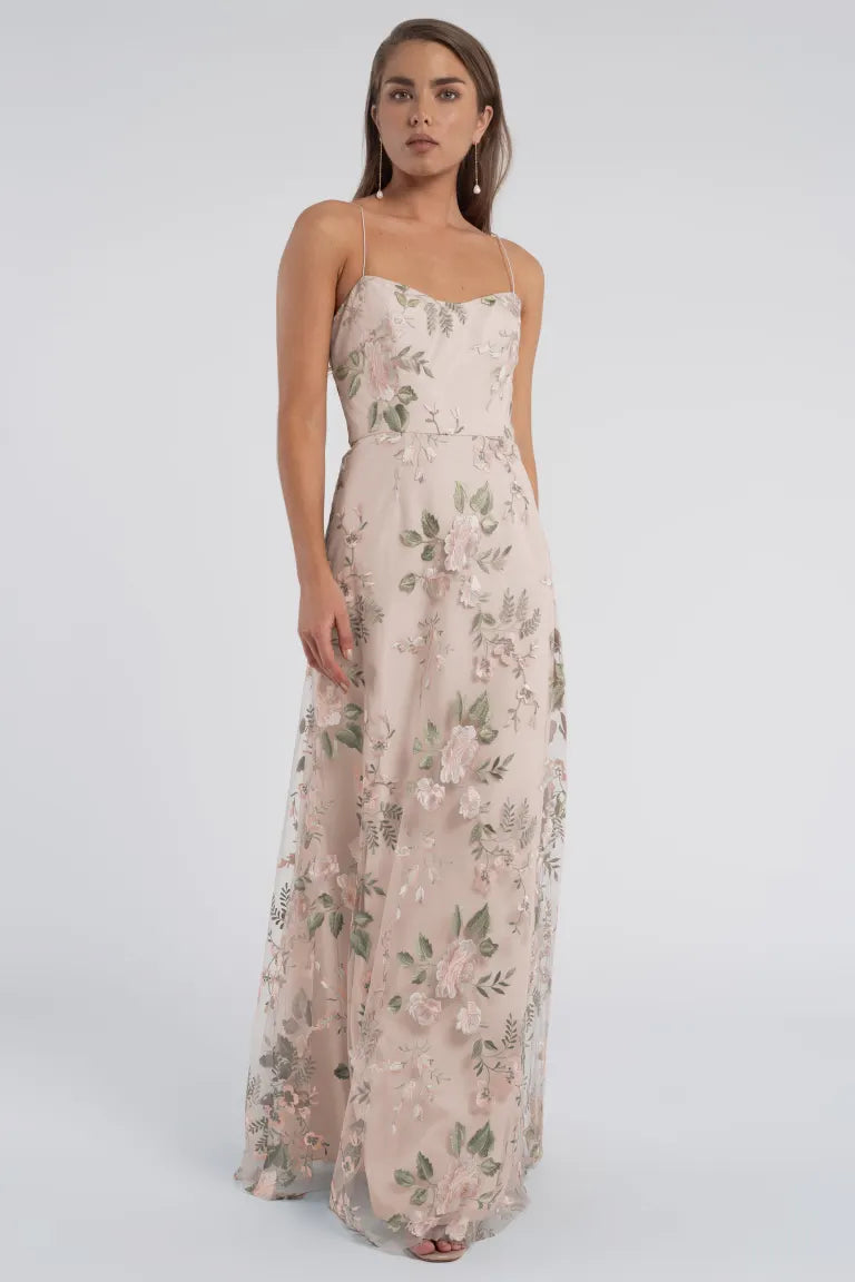 Woman posing in an enchanted floral tulle evening dress, Bergamot Bridal's Drew - Jenny Yoo Bridedmaid Dress.