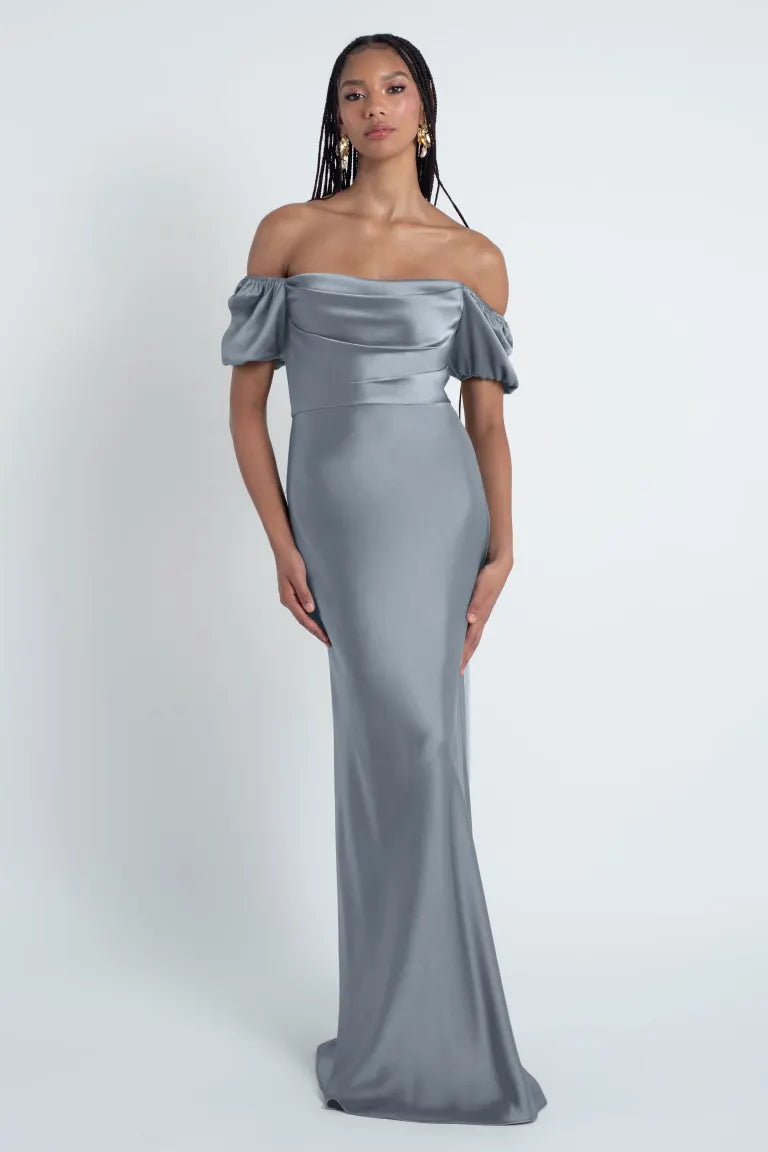 Woman in an elegant off-shoulder grey Eliana - Jenny Yoo Bridesmaid Dress from Bergamot Bridal.