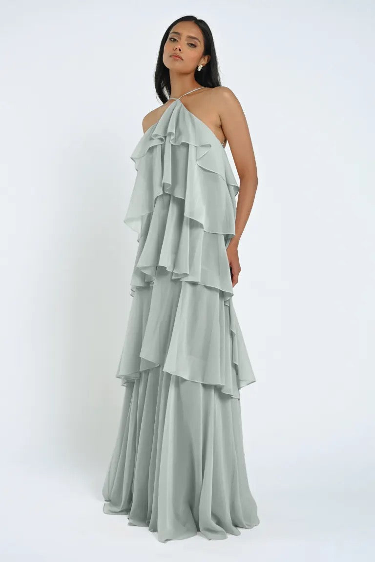 Woman wearing a Farley Bridesmaid Dress by Jenny Yoo from Bergamot Bridal, standing against a plain background.