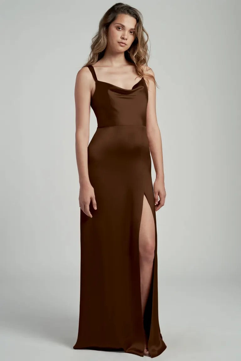 Woman in a Gina - Bridesmaid Dress by Jenny Yoo in brown satin with a thigh-high slit from Bergamot Bridal.