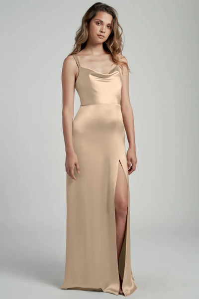 Woman posing in an elegant satin bridesmaid dress with a cowl neckline, Gina - Bridesmaid Dress by Jenny Yoo from Bergamot Bridal.