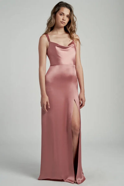 Woman in a satin bridesmaid dress featuring a cowl neckline and a thigh-high slit, the Gina - Bridesmaid Dress by Jenny Yoo from Bergamot Bridal.