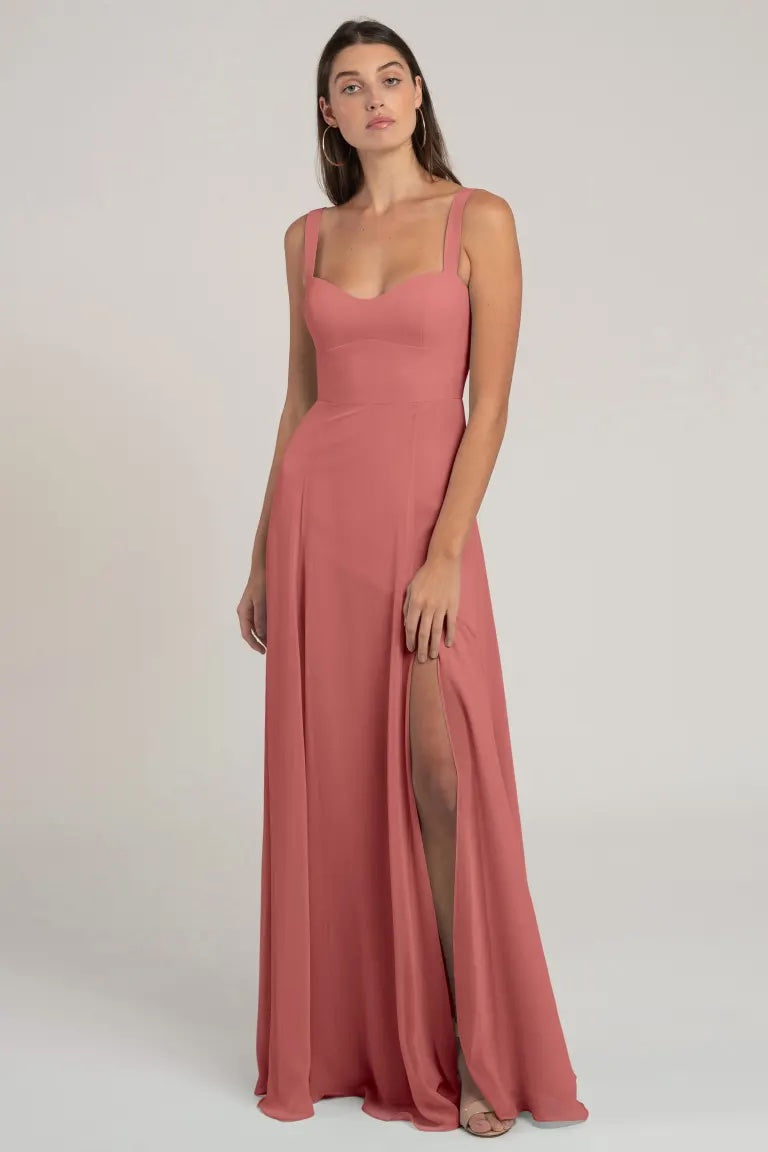 Sentence with replaced product:

Woman in an elegant chiffon bridesmaid dress with a sweetheart neckline and a thigh-high slit, the Harris Bridesmaid Dress by Jenny Yoo from Bergamot Bridal.
