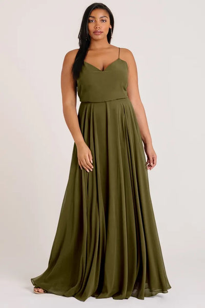 Woman in an elegant olive green Inesse bridesmaid dress by Jenny Yoo with a universally flattering V-neck from Bergamot Bridal.