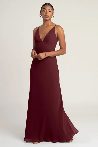 Woman in an elegant Bergamot Bridal Jude - Bridesmaid Dress by Jenny Yoo chiffon evening gown.