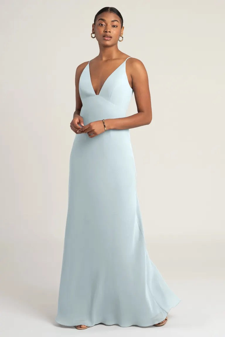 A woman in an elegant Jude - Bridesmaid Dress by Jenny Yoo from Bergamot Bridal.