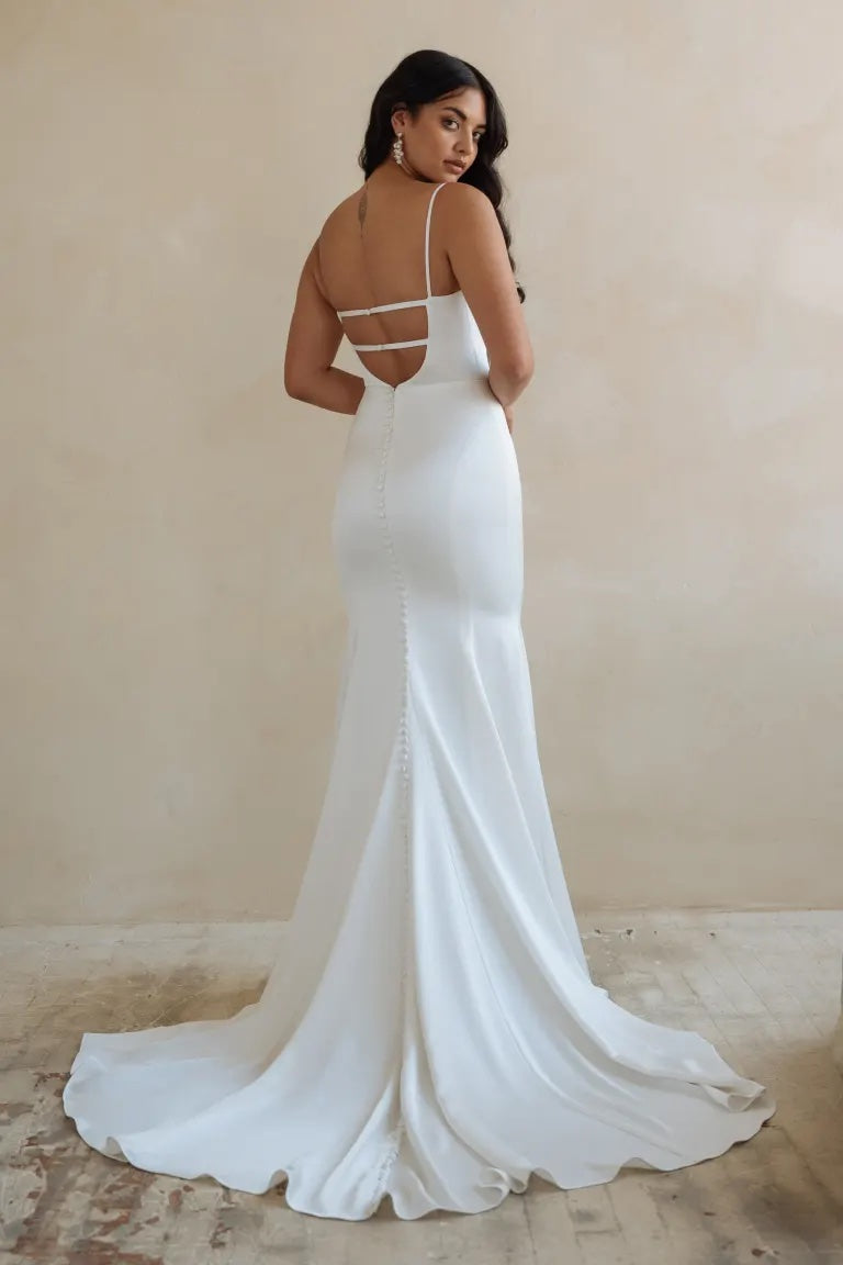 The back view of a woman in a stunning Lydia - Jenny Yoo wedding dress from Bergamot Bridal.