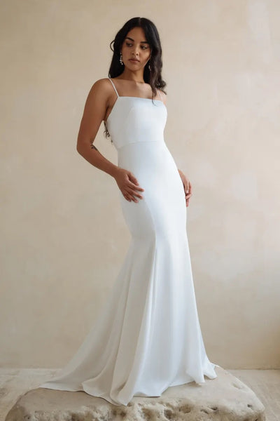 Woman posing in an elegant Lydia - Jenny Yoo Wedding Dress slip gown from Bergamot Bridal.