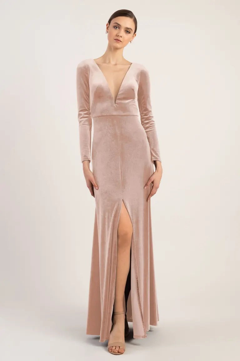Woman in a luxe velvet Malia bridesmaid dress by Jenny Yoo with a thigh-high slit from Bergamot Bridal.