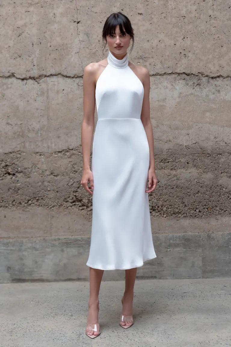 A model wearing the Nicolette - Jenny Yoo Little White Dress by Bergamot Bridal.
