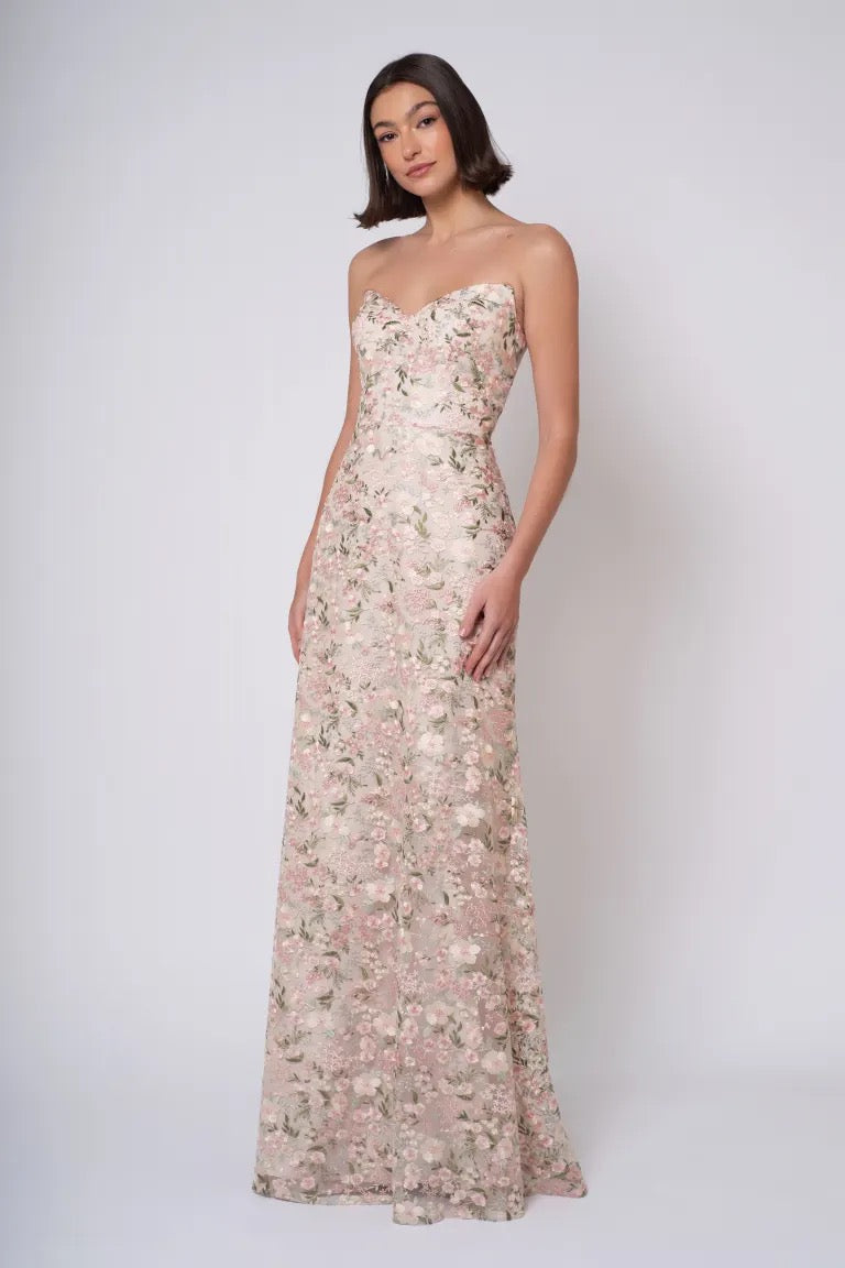 Woman posing in a Jenny Yoo Bridesmaid Dress with Ophelia embroidery against a white background from Bergamot Bridal.