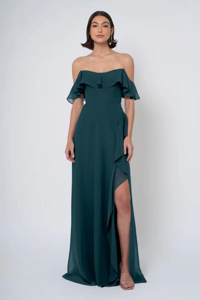 Woman in an elegant Jenny Yoo Bridesmaid Dress with an off-the-shoulder neckline and a side slit from Bergamot Bridal.