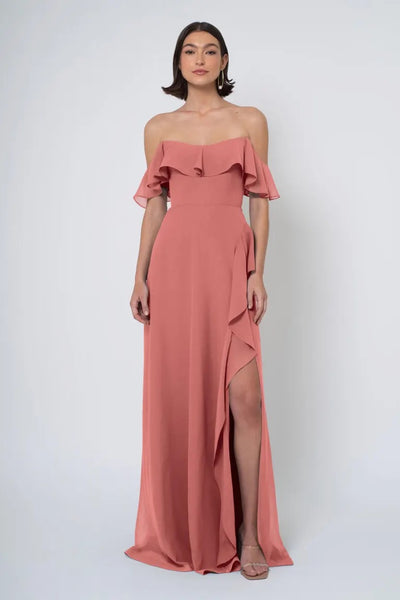 Woman in an elegant off-the-shoulder Jenny Yoo Bridesmaid Dress with a side slit from Bergamot Bridal.