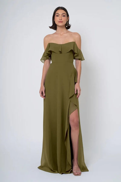 Woman in an olive green off-the-shoulder Jenny Yoo Bridesmaid Dress with a side slit from Bergamot Bridal.