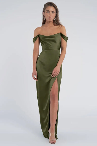 Woman in a Sawyer - Bridesmaid Dress by Jenny Yoo gown with a thigh-high slit and cowl neckline from Bergamot Bridal.