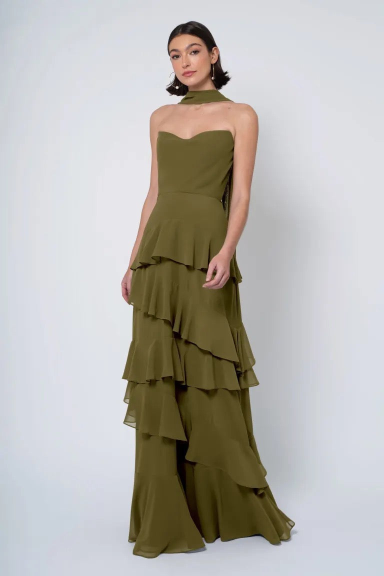 A woman models a strapless Jenny Yoo Bridesmaid Dress with tiered ruffles from Bergamot Bridal.