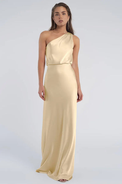 Woman in an elegant one-shoulder neckline Sterling dress from Jenny Yoo Bridesmaid at Bergamot Bridal.