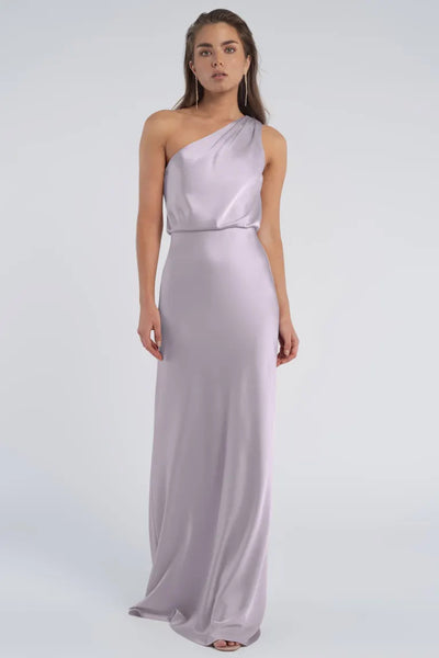 Woman in a Sterling - Jenny Yoo Bridesmaid luxe satin lavender one-shoulder gown from Bergamot Bridal.