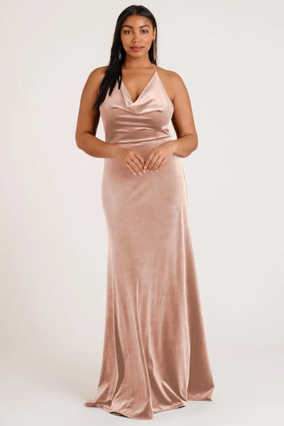Woman in an elegant Sullivan - Bridesmaid Dress by Jenny Yoo with a halter cowl neckline from Bergamot Bridal.