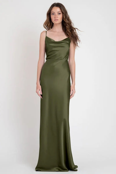 Woman modeling a Sylvie - Bridesmaid Dress by Jenny Yoo in olive green satin, from Bergamot Bridal.