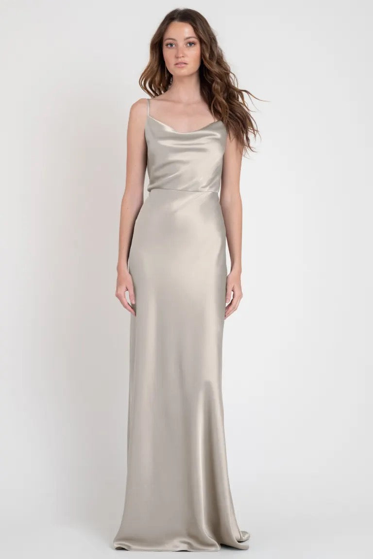 A woman in an elegant Sylvie bridesmaid dress by Jenny Yoo, reminiscent of Old Hollywood, from Bergamot Bridal.