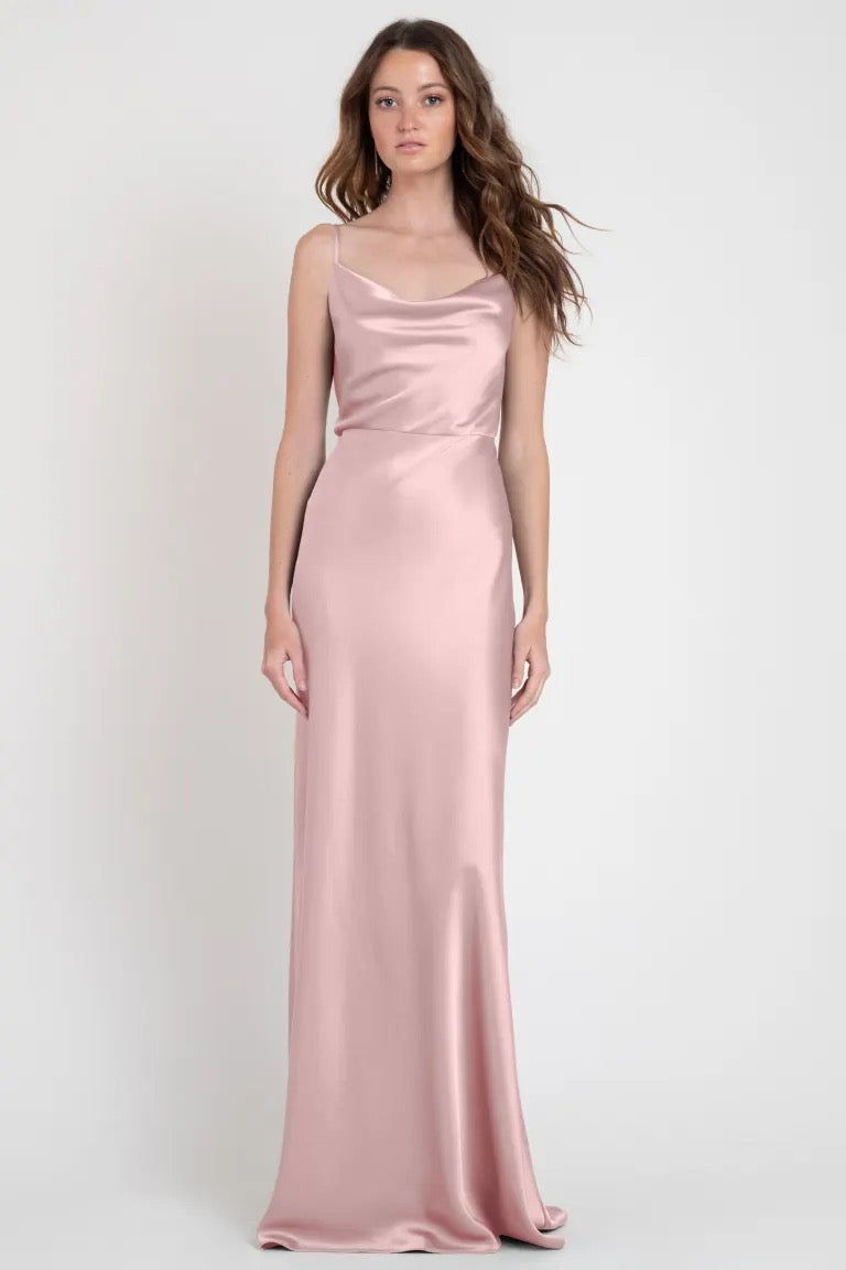 Woman in a stylish, long pink satin slip dress, invoking Old Hollywood glamour - Sylvie Bridesmaid Dress by Bergamot Bridal.