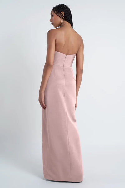 Woman in an elegant Jenny Yoo Bridesmaid Dress crafted from luxe Faille fabric, featuring off the shoulder sleeves, viewed from the back by Bergamot Bridal.