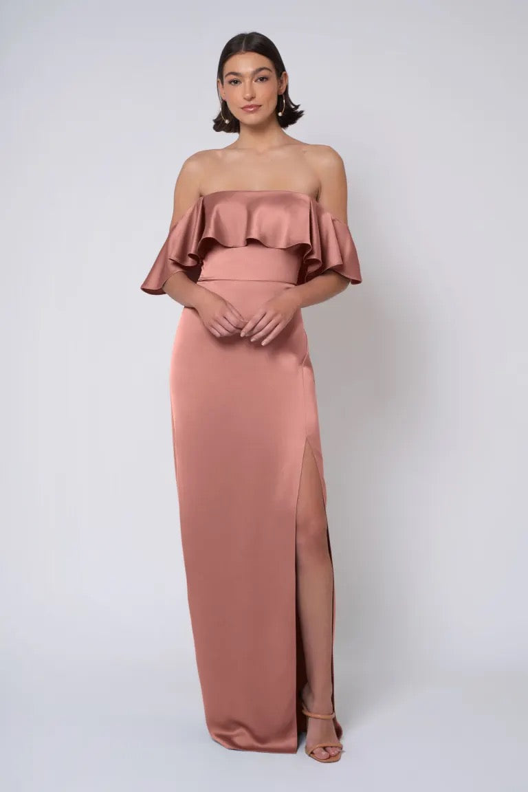 Woman in an elegant Jenny Yoo Bridesmaid Dress with a strapless neckline and thigh-high slit.