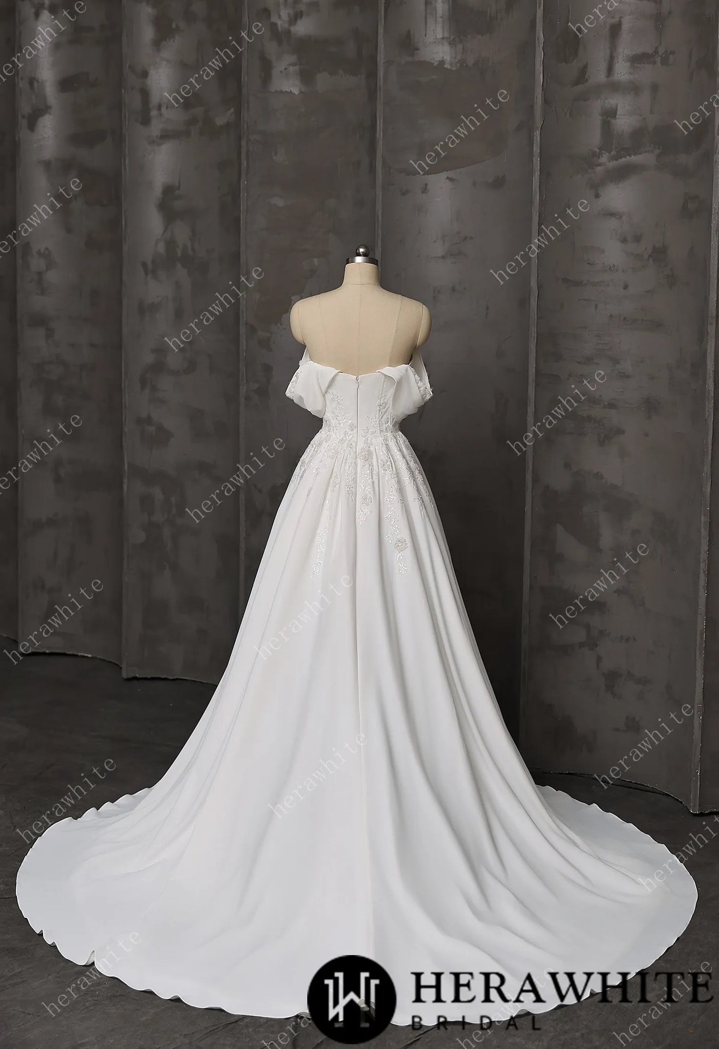 The Bergamot Bridal Coloured Embroidered A-Line Gown is displayed on a mannequin against a dark, textured background.