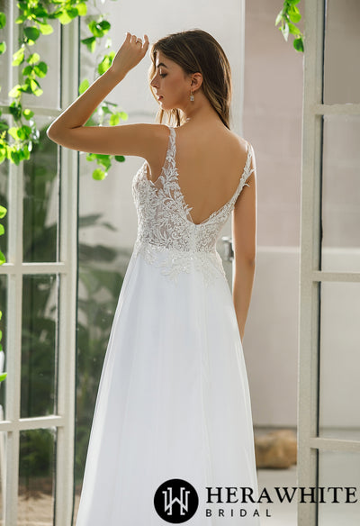 The back view of a bride wearing a Bergamot Bridal Illusion Bodice Chiffon Skirt A-Line Bridal Gown.