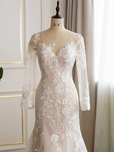 An Ultimate Floral Fit and Flare Long Sleeve Wedding Dress - Off The Rack with illusion sleeves on a mannequin.