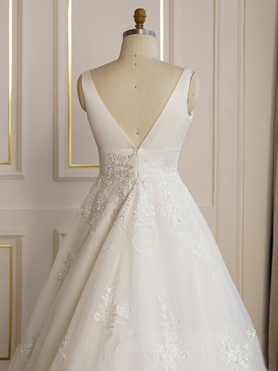 A Simply V-Neck A-line Satin Wedding Dress in a Bergamot Bridal shop.