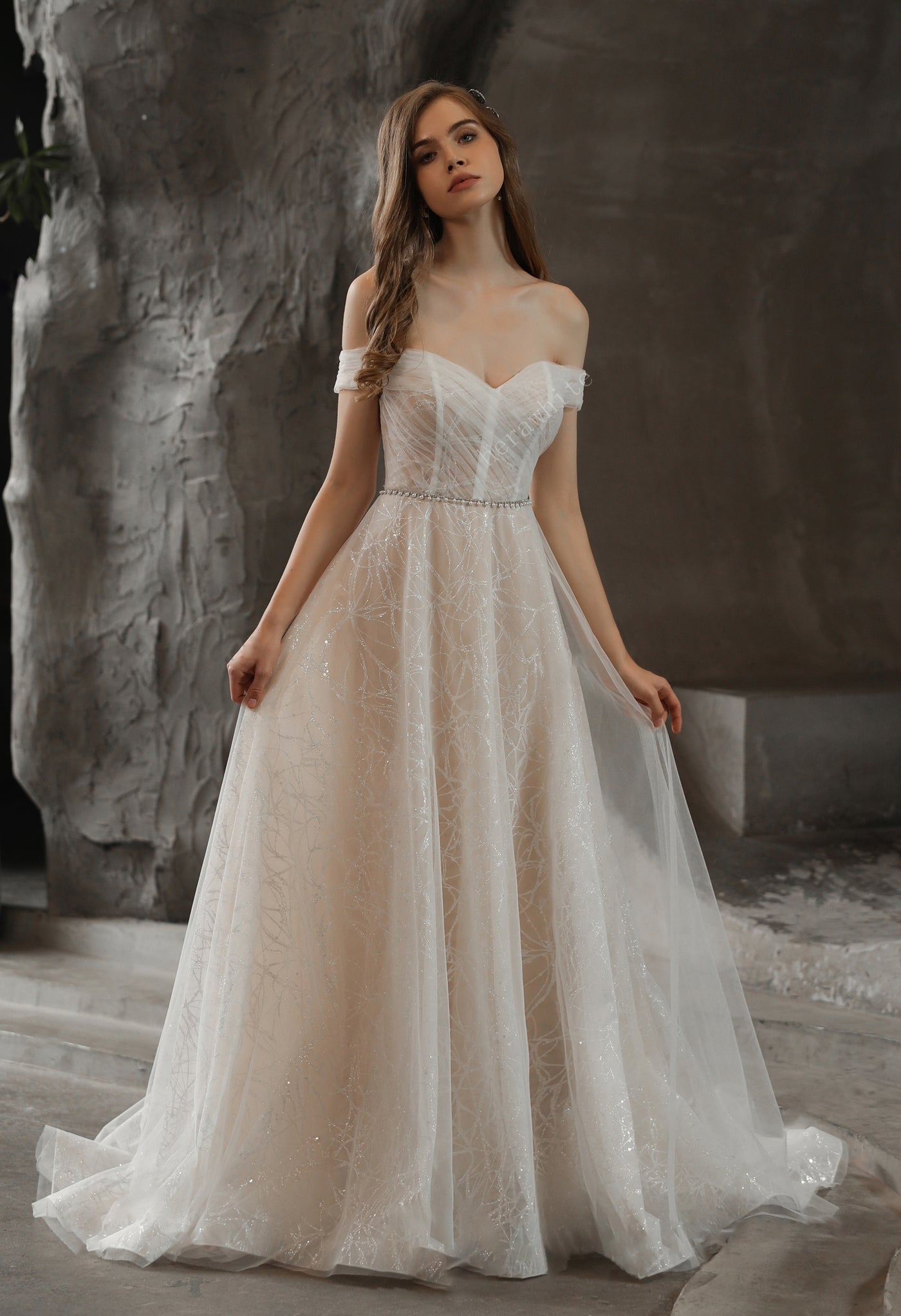 Shimmer Off-the-shoulder Neckline A-line Tulle Wedding Dress with lace and beading available at Bergamot Bridal bridal shops in London.
