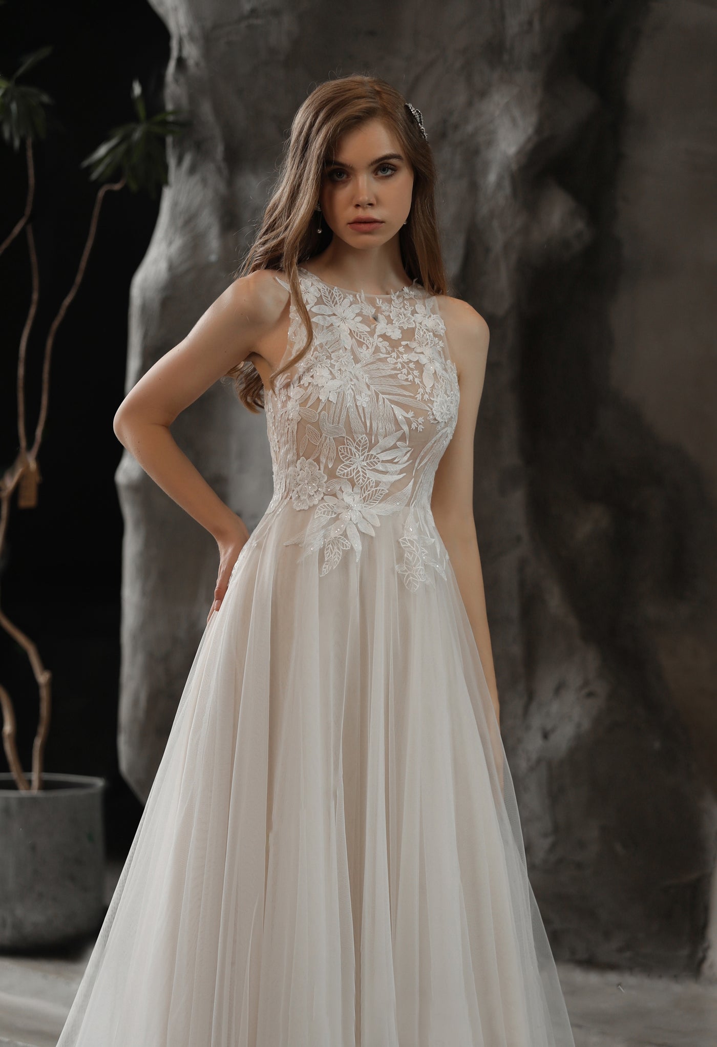 The bride is wearing a white Bergamot Bridal High Neck A-line Wedding Gown with Sequined Lace.