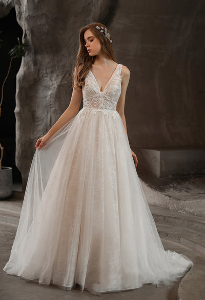 A Lovely Lace V-neck wedding dress with Tulle Skirt is available at Bergamot Bridal.