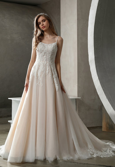 A bridal shop in London is showcasing a stunning Bergamot Bridal Beaded Lace A-line Wedding Gown with Scoop Neckline in a room.