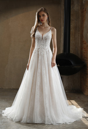 A beautiful Beaded A-Line Wedding Dress with Spaghetti Straps and lace appliques available at Bergamot Bridal in London.