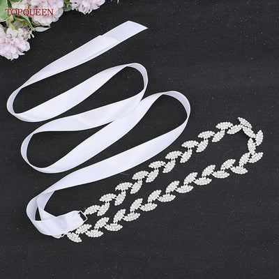 A Silver leaf crystal bridal belt sash with rhinestones, available at Bergamot Bridal shops London Ontario.