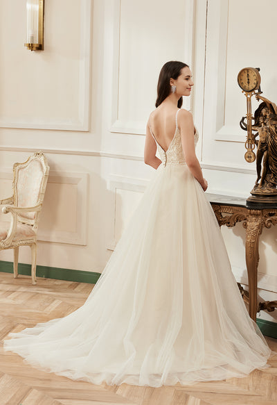 The back of a Bohemian Spaghetti Strap V-Back A-Line Ball Gown Bridal Gown - Off The Rack in Bergamot Bridal bridal shop.