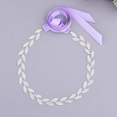Silver leaf crystal bridal belt sash with purple ribbon can be found at bridal shops in London, Ontario.