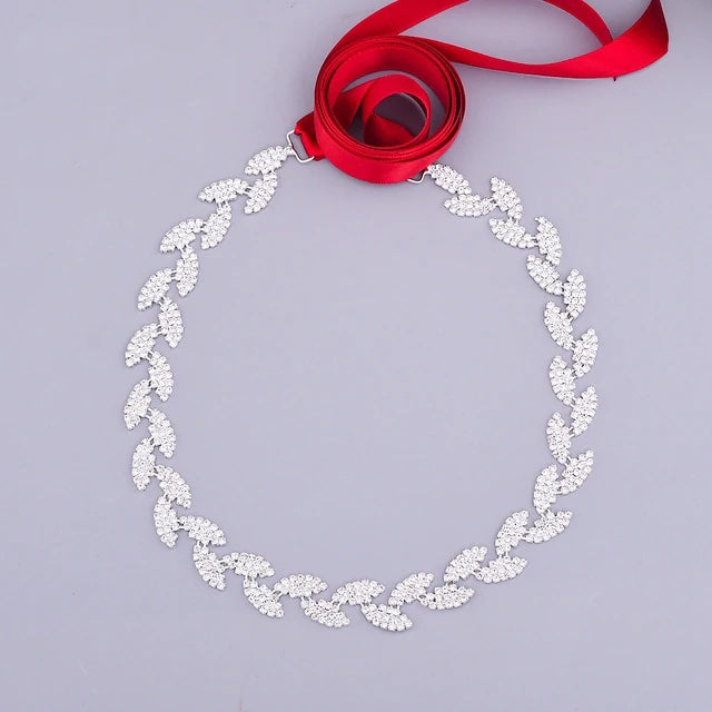 A Silver leaf crystal bridal belt sash from Bergamot Bridal, perfect for bridal shops.