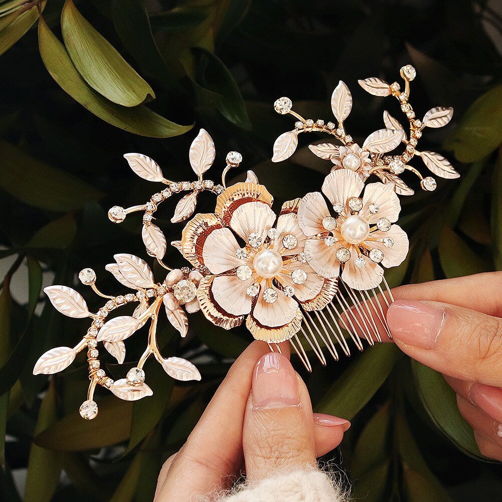 A person holding a Bergamot Bridal Two Tone Gold/Rose Gold Flower & Leaves Hair Comb visits bridal shops in London.
